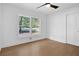 Spacious bedroom with large window and hardwood floors at 350 Jayne Ellen Way, Alpharetta, GA 30009
