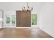 Bright dining room with hardwood floors and a wood accent wall at 350 Jayne Ellen Way, Alpharetta, GA 30009
