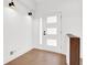 Light and airy entryway with hardwood floors and white walls at 350 Jayne Ellen Way, Alpharetta, GA 30009