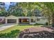 Newly renovated midcentury ranch house with gray garage door at 350 Jayne Ellen Way, Alpharetta, GA 30009