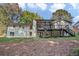 Back exterior view of a charming house with a large deck at 350 Jayne Ellen Way, Alpharetta, GA 30009