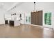 Modern kitchen with island, hardwood floors, and stainless steel appliances at 350 Jayne Ellen Way, Alpharetta, GA 30009