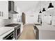 Modern kitchen with a large island, stainless steel appliances, and white cabinetry at 350 Jayne Ellen Way, Alpharetta, GA 30009