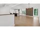 Open concept living space with hardwood floors and modern fireplace at 350 Jayne Ellen Way, Alpharetta, GA 30009