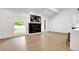 Open living space with hardwood floors and a modern fireplace at 350 Jayne Ellen Way, Alpharetta, GA 30009