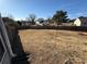 Large backyard with grass and wooden fence at 1563 Nicole Ridge Ct, Loganville, GA 30052