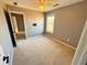 Bedroom with carpet, window and access to hallway at 1563 Nicole Ridge Ct, Loganville, GA 30052