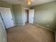 Spacious bedroom with neutral walls and carpet at 1563 Nicole Ridge Ct, Loganville, GA 30052