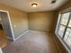 Bright dining room with large window and carpet at 1563 Nicole Ridge Ct, Loganville, GA 30052