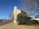 Tan house exterior with large tree and fence at 1563 Nicole Ridge Ct, Loganville, GA 30052