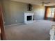 Living room with fireplace and neutral decor at 1563 Nicole Ridge Ct, Loganville, GA 30052