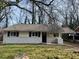 Charming ranch home with white brick exterior and black shutters at 1739 Carter Cir, Atlanta, GA 30344