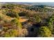 Aerial view of property showcasing expansive land and wooded area at 1921 W Hightower W Trl, Conyers, GA 30012