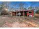 Rustic barn with horse stalls and covered area at 1921 W Hightower W Trl, Conyers, GA 30012