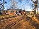 Back view of brick ranch house with swing set at 1921 W Hightower W Trl, Conyers, GA 30012