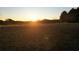 Sunset view of open land, ideal for building your dream home at 1921 W Hightower W Trl, Conyers, GA 30012