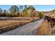 Gravel road leads to pasture with horses at 1921 W Hightower W Trl, Conyers, GA 30012