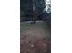 Small backyard with a tree and wooden fence at 390 Lakeridge Ct, Riverdale, GA 30274