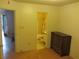 Bedroom featuring hardwood floors, and adjacent bathroom at 390 Lakeridge Ct, Riverdale, GA 30274