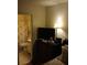 Bedroom with a view of the bathroom and a TV at 390 Lakeridge Ct, Riverdale, GA 30274