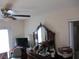 Bedroom with a dresser, mirror, and a television at 390 Lakeridge Ct, Riverdale, GA 30274