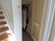 Small coat closet with hanging rod at 390 Lakeridge Ct, Riverdale, GA 30274