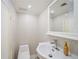 Clean bathroom with white tile, a modern sink, and a toilet at 4060 Haverhill Ne Dr # F, Atlanta, GA 30342