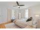 Bright bedroom with hardwood floors and ceiling fan at 4060 Haverhill Ne Dr # F, Atlanta, GA 30342