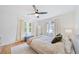 Bright bedroom with hardwood floors and ceiling fan at 4060 Haverhill Ne Dr # F, Atlanta, GA 30342