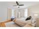 Bright bedroom with hardwood floors and ceiling fan at 4060 Haverhill Ne Dr # F, Atlanta, GA 30342