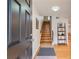 Entryway with dark door, hardwood floor, and wooden staircase at 4060 Haverhill Ne Dr # F, Atlanta, GA 30342