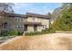 Two-story tan house with dark brown trim, front door, and walkway, light dusting of snow at 4060 Haverhill Ne Dr # F, Atlanta, GA 30342