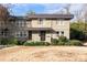 Two-story tan house with dark brown trim, front door, and walkway, light dusting of snow at 4060 Haverhill Ne Dr # F, Atlanta, GA 30342