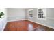 Bright dining room with hardwood floors and wainscoting at 5768 Wesson Dr, Ellenwood, GA 30294