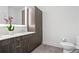 Bathroom with double vanity, built-in storage, and gray tile at 775 Juniper Ne St # 413, Atlanta, GA 30308