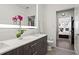 Spa-like bathroom with double vanity and a view of the bedroom at 775 Juniper Ne St # 413, Atlanta, GA 30308