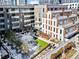 Modern apartment building with courtyard featuring a snow-dusted lawn and landscaping at 775 Juniper Ne St # 413, Atlanta, GA 30308