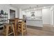 Bright dining area with wood table and four stools at 775 Juniper Ne St # 413, Atlanta, GA 30308