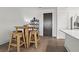 Kitchen dining area with wood table and four stools at 775 Juniper Ne St # 413, Atlanta, GA 30308