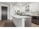 Modern kitchen with stainless steel appliances and an island at 775 Juniper Ne St # 413, Atlanta, GA 30308