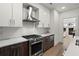 Modern kitchen with stainless steel appliances and an island at 775 Juniper Ne St # 413, Atlanta, GA 30308