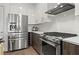 Modern kitchen with stainless steel appliances and an island at 775 Juniper Ne St # 413, Atlanta, GA 30308