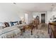 Open living space with hardwood floors, sectional sofa, and adjacent dining area at 775 Juniper Ne St # 413, Atlanta, GA 30308