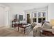 Bright living room with hardwood floors, comfy sofa, and access to balcony at 775 Juniper Ne St # 413, Atlanta, GA 30308