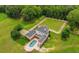Aerial view of the house, pool, and expansive backyard at 833 Hines Rd, Moreland, GA 30259