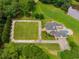 Aerial view of house, pool, and expansive lawn at 833 Hines Rd, Moreland, GA 30259