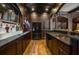 Basement bar with copper sink and black appliances at 833 Hines Rd, Moreland, GA 30259