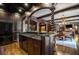 Long bar with a copper sink and black appliances at 833 Hines Rd, Moreland, GA 30259