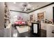 Charming craft/hobby room with built-in shelving and a cozy sitting area at 833 Hines Rd, Moreland, GA 30259