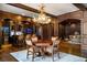 Game room with a large wooden table and antler chandelier at 833 Hines Rd, Moreland, GA 30259